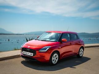 Red Suzuki Swift 1.1 Petrol – Busola Rent a Car Herceg Novi